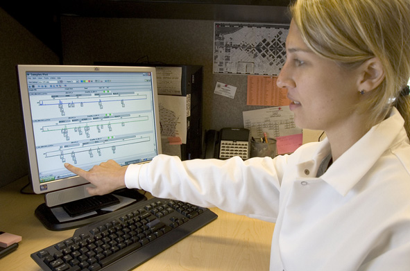forensic scientist explains DNA search on a computer screen