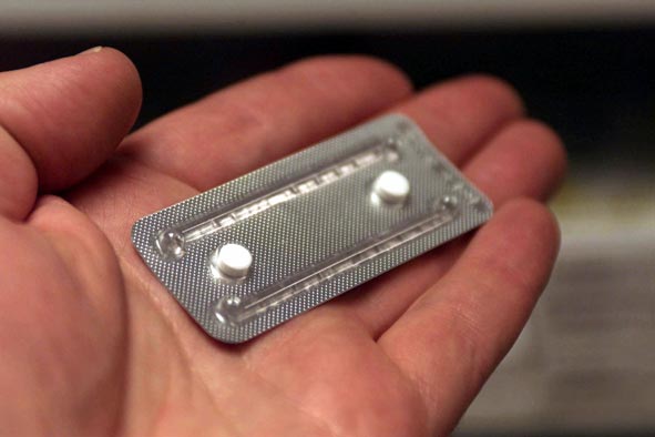 hand holding emergency contraception